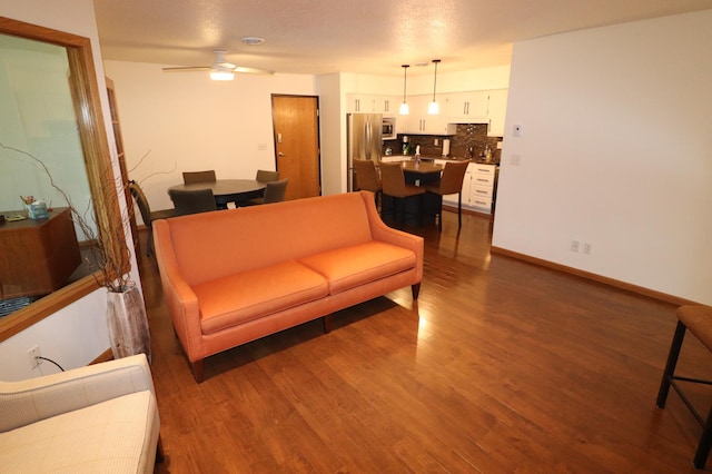 1841 Kemberidge Rd, Detroit Lakes, MN 56501 - living area featuring wood finished floors, ceiling fan, and baseboards