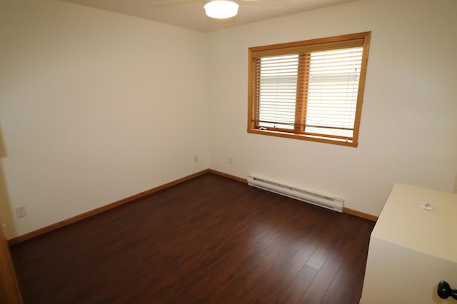 1841 Kemberidge Rd, Detroit Lakes, MN 56501 - spare room with a baseboard heating unit, a ceiling fan, dark wood-style flooring, and baseboards