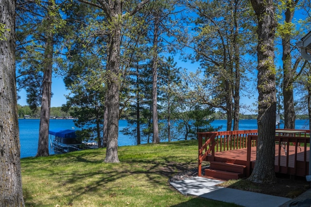 601 Idlewild St Unit 102, Balsam Lake, WI 54810 - view of green lawn featuring a deck with water view
