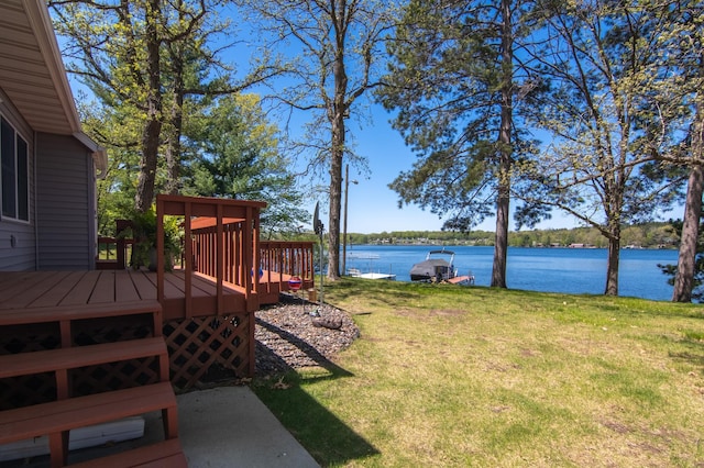601 Idlewild St Unit 102, Balsam Lake, WI 54810 - view of green lawn with a deck with water view