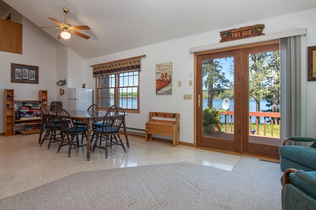 601 Idlewild St Unit 102, Balsam Lake, WI 54810 - dining area with ceiling fan, baseboards, tile patterned floors, and high vaulted ceiling