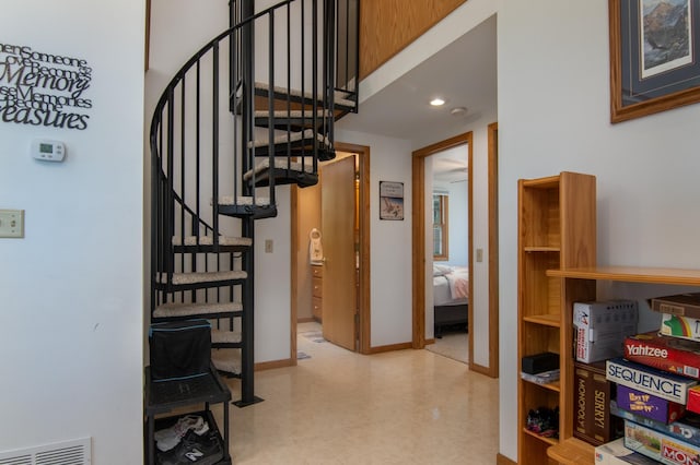 601 Idlewild St Unit 102, Balsam Lake, WI 54810 - corridor with stairway, tile patterned floors, and baseboards