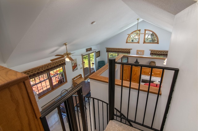 601 Idlewild St Unit 102, Balsam Lake, WI 54810 - staircase featuring lofted ceiling, ceiling fan, and carpet