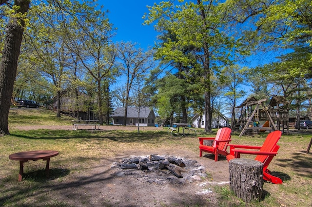 601 Idlewild St Unit 102, Balsam Lake, WI 54810 - view of yard with a fire pit and a playground
