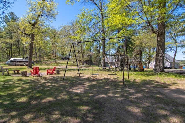 601 Idlewild St Unit 102, Balsam Lake, WI 54810 - view of play area with a lawn