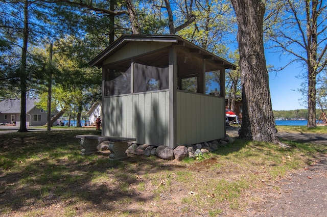 601 Idlewild St Unit 102, Balsam Lake, WI 54810 - view of outdoor structure featuring a sunroom and a water view
