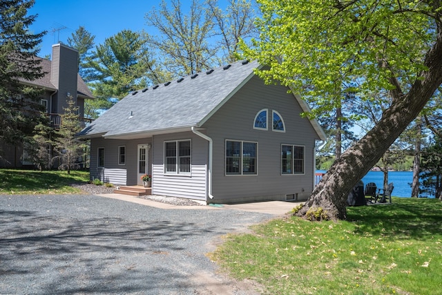 601 Idlewild St Unit 102, Balsam Lake, WI 54810 - view of front of home with a front lawn, a water view, and roof with shingles