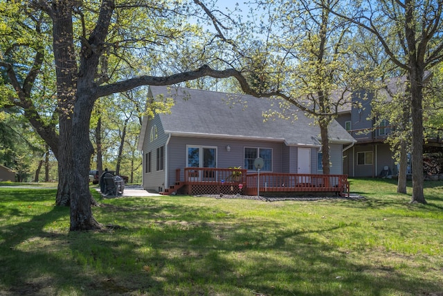 601 Idlewild St Unit 102, Balsam Lake, WI 54810 - view of front of property with roof with shingles, a deck, and a front lawn