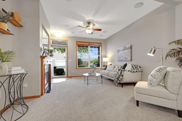 3314 Hazel Trl Unit G, Woodbury, MN 55129 - living room featuring carpet, ceiling fan, baseboards, and a glass covered fireplace