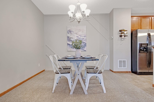 3314 Hazel Trl Unit G, Woodbury, MN 55129 - dining area with a chandelier, light carpet, and baseboards