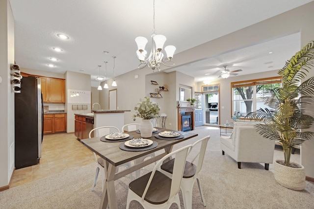 3314 Hazel Trl Unit G, Woodbury, MN 55129 - dining room with ceiling fan, a chandelier, a glass covered fireplace, recessed lighting, and light carpet