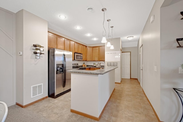 3314 Hazel Trl Unit G, Woodbury, MN 55129 - kitchen featuring appliances with stainless steel finishes, decorative light fixtures, baseboards, a peninsula, and recessed lighting