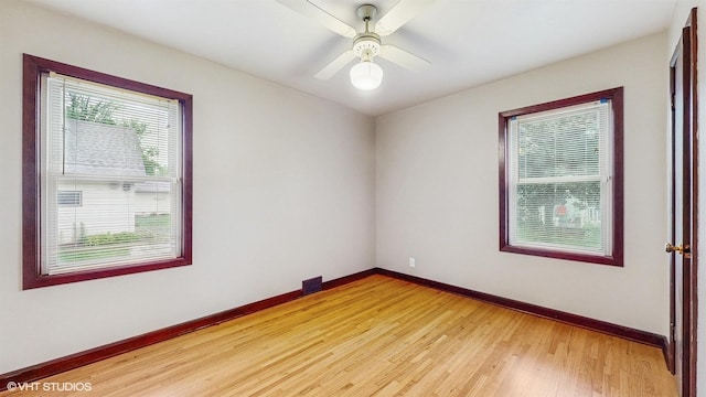 718 Atwood St S, Shakopee, MN 55379 - unfurnished room with baseboards, light wood-style flooring, and a ceiling fan