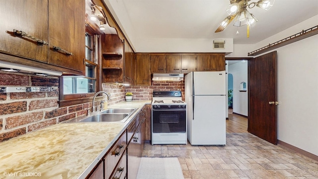 718 Atwood St S, Shakopee, MN 55379 - kitchen featuring white appliances, under cabinet range hood, a ceiling fan, a sink, and backsplash