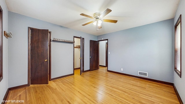 718 Atwood St S, Shakopee, MN 55379 - unfurnished bedroom featuring light wood finished floors, baseboards, and a ceiling fan