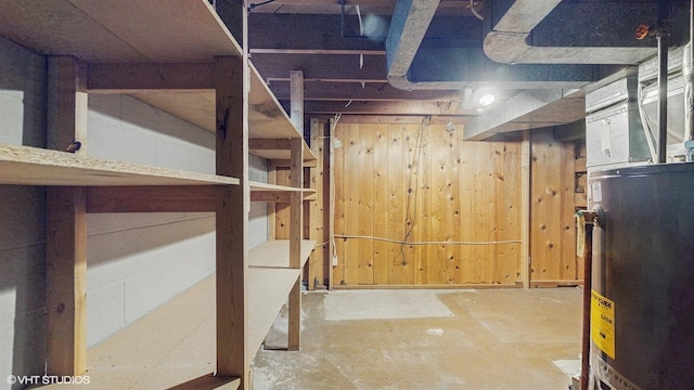 718 Atwood St S, Shakopee, MN 55379 - unfinished below grade area featuring water heater and wooden walls