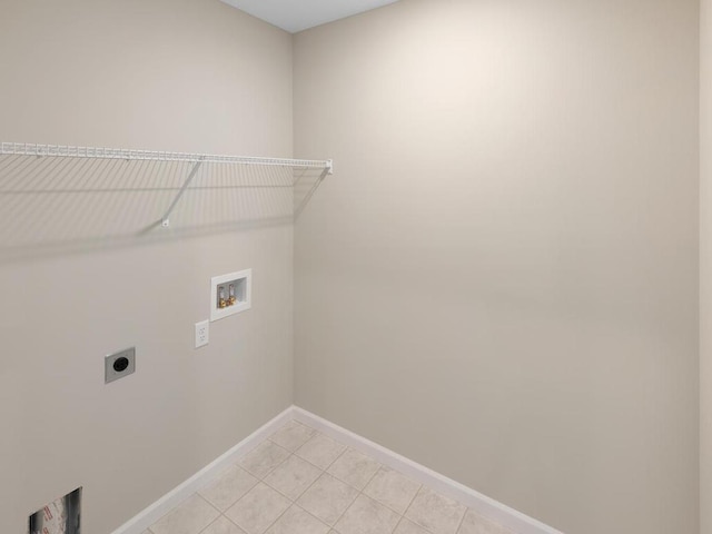 16148 Finale Ave N, Hugo, MN 55038 - laundry area with electric dryer hookup, washer hookup, baseboards, and light tile patterned floors