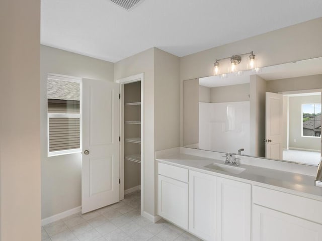 16148 Finale Ave N, Hugo, MN 55038 - full bathroom featuring vanity, baseboards, and tile patterned flooring