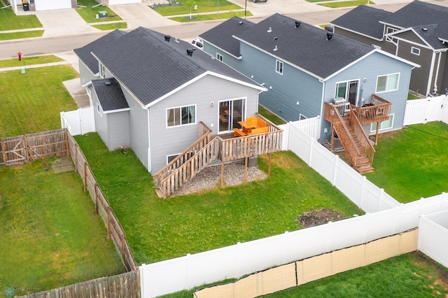 rear view of house featuring stairway, a wooden deck, and a shingled roof