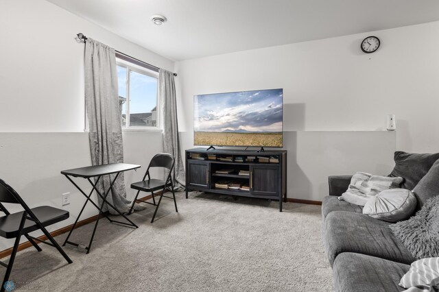 living room with carpet flooring and baseboards