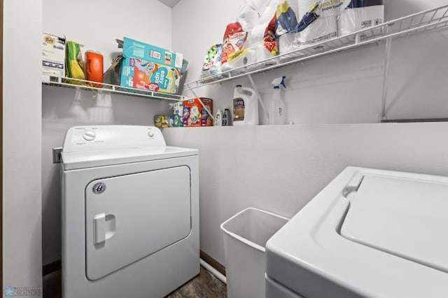 laundry area with independent washer and dryer