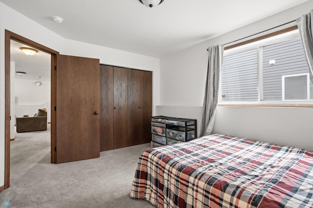 carpeted bedroom with a closet