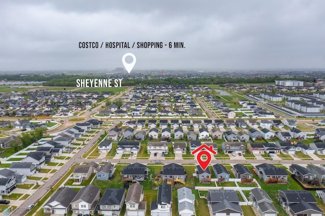 aerial view of property and surrounding area with nearby suburban area