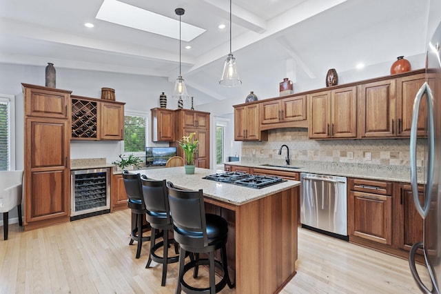 5401 Mount Normandale Dr, Bloomington, MN 55437 - kitchen with wine cooler, stainless steel appliances, a sink, tasteful backsplash, and a kitchen island