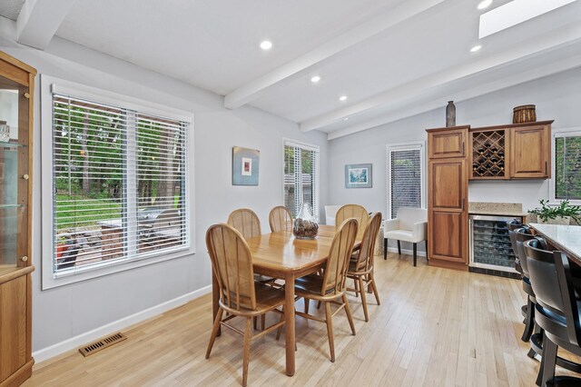 5401 Mount Normandale Dr, Bloomington, MN 55437 - dining space featuring wine cooler, a bar, light wood-style flooring, recessed lighting, and baseboards