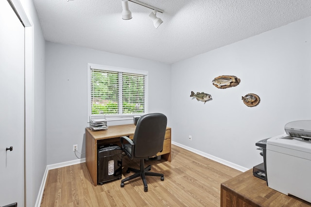 5401 Mount Normandale Dr, Bloomington, MN 55437 - office area with light wood finished floors, track lighting, a textured ceiling, and baseboards
