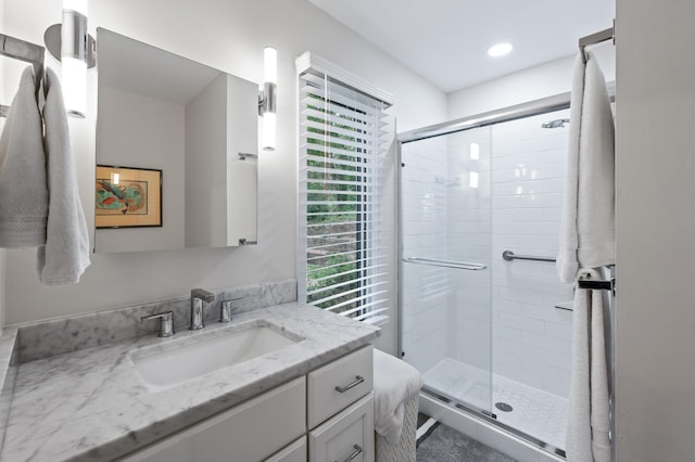 5401 Mount Normandale Dr, Bloomington, MN 55437 - bathroom featuring a shower stall, vanity, and recessed lighting