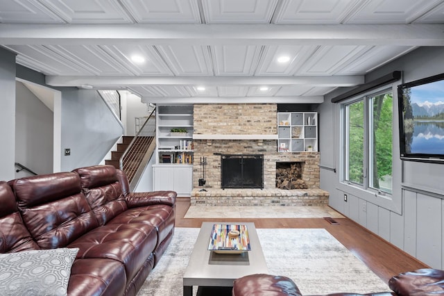 5401 Mount Normandale Dr, Bloomington, MN 55437 - living room featuring wood finished floors, a fireplace, stairs, recessed lighting, and built in features