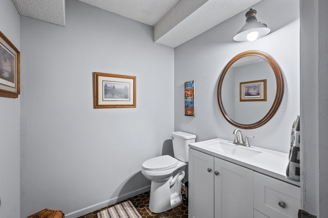 5401 Mount Normandale Dr, Bloomington, MN 55437 - half bathroom featuring toilet, vanity, baseboards, and tile patterned flooring