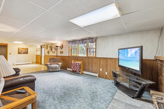 4708 Virginia Ave N, New Hope, MN 55428 - living area featuring wainscoting, wooden walls, a drop ceiling, and a baseboard radiator