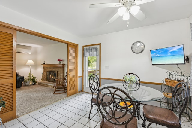 4708 Virginia Ave N, New Hope, MN 55428 - dining area featuring a wall unit AC, a fireplace, light tile patterned flooring, and ceiling fan