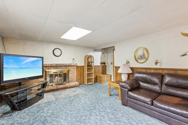 4708 Virginia Ave N, New Hope, MN 55428 - living room with a drop ceiling, carpet, wainscoting, wood walls, and a brick fireplace