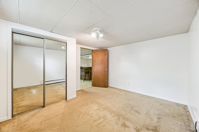 4708 Virginia Ave N, New Hope, MN 55428 - unfurnished bedroom with carpet flooring, a baseboard heating unit, a closet, and a drop ceiling