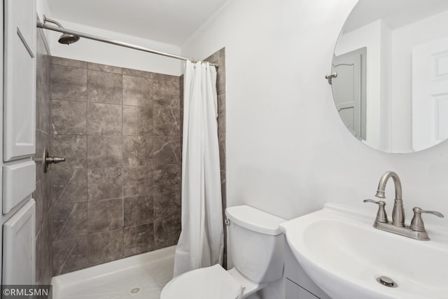 1134 Lincoln St NE, Minneapolis, MN 55413 - full bathroom with a sink, a stall shower, and toilet