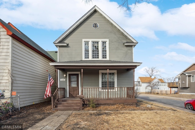 1134 Lincoln St NE, Minneapolis, MN 55413 - view of front facade with a porch and fence