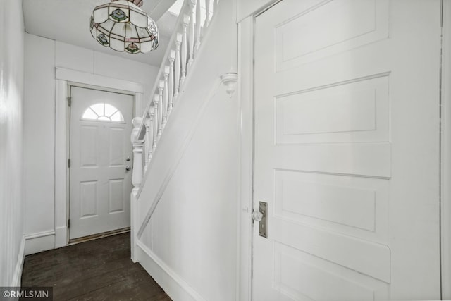 1134 Lincoln St NE, Minneapolis, MN 55413 - doorway to outside with stairs, dark wood-style floors, and baseboards