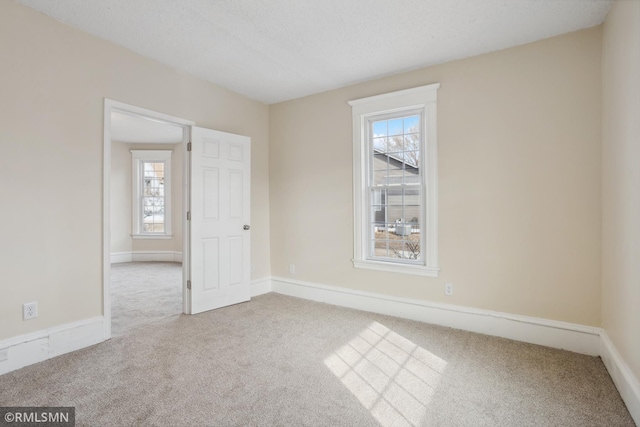 1134 Lincoln St NE, Minneapolis, MN 55413 - empty room with carpet flooring and baseboards