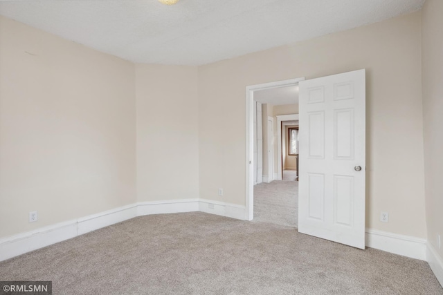 1134 Lincoln St NE, Minneapolis, MN 55413 - carpeted empty room with baseboards