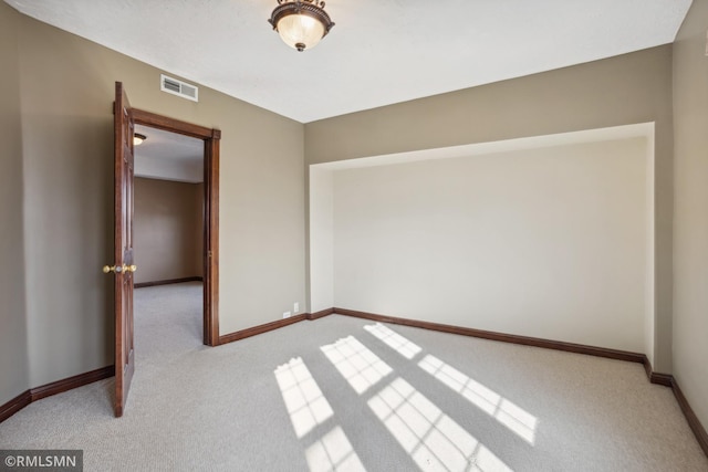 1134 Lincoln St NE, Minneapolis, MN 55413 - carpeted spare room featuring baseboards