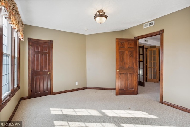1134 Lincoln St NE, Minneapolis, MN 55413 - empty room with carpet and baseboards