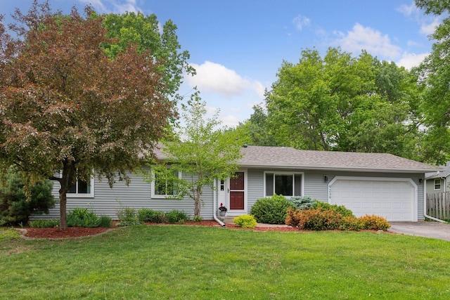 9239 Harbor Ln N, Maple Grove, MN 55369 - ranch-style home featuring an attached garage, driveway, and a front lawn