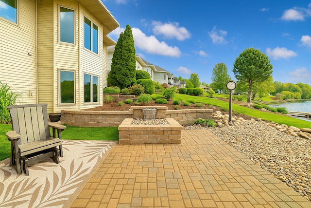 view of patio / terrace with a water view