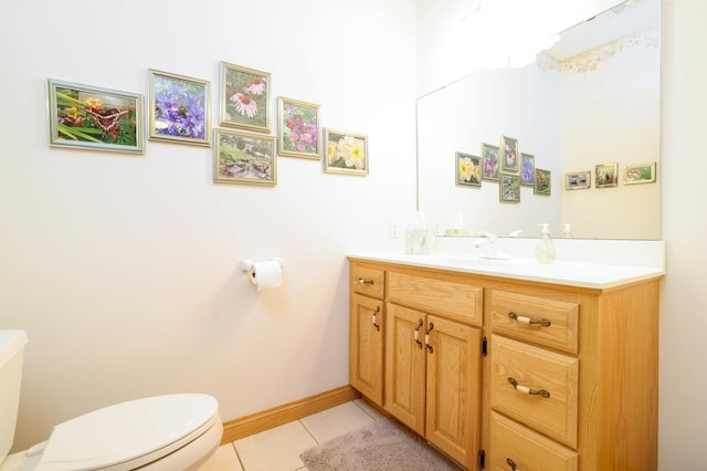 bathroom featuring toilet, tile patterned floors, and vanity