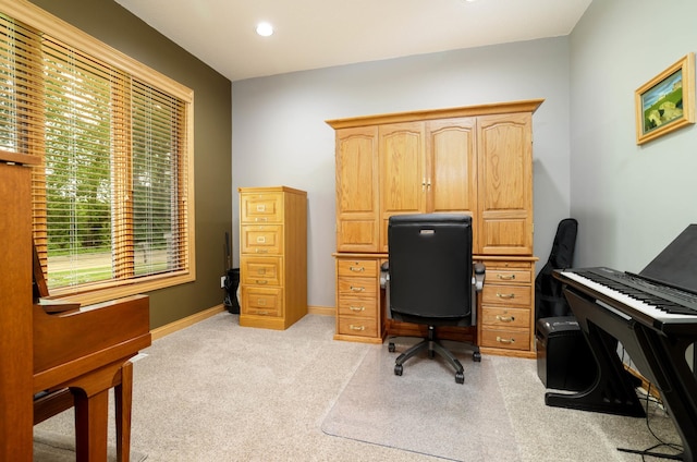 office space featuring light colored carpet and baseboards