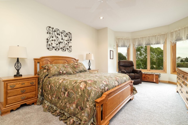 carpeted bedroom featuring ceiling fan and recessed lighting