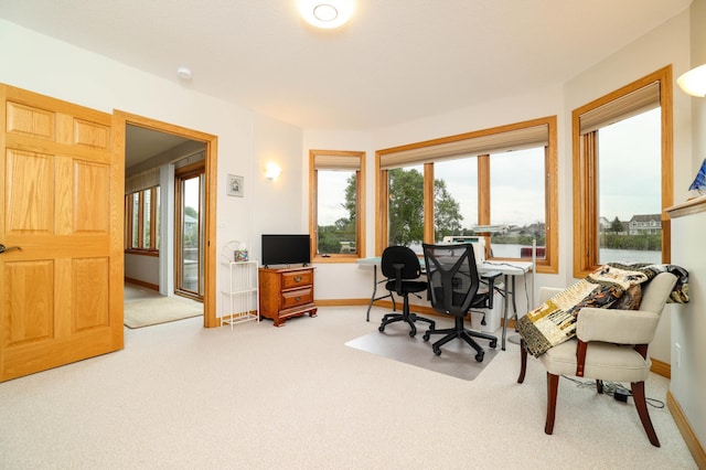 office area with carpet flooring and baseboards